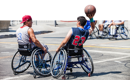 A man in the wheelchair-division looks to make a pass during a Nike 3-on-3 game.